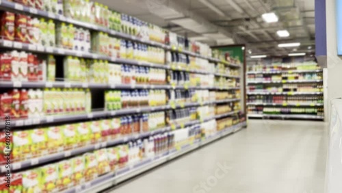 Wallpaper Mural Choosing a dairy products at supermarket.Grocery stores .blurred background Torontodigital.ca