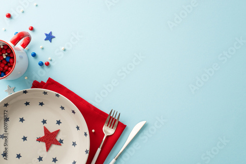 Fotografia, Obraz Captivating top view of table set for celebrating Independence Day, adorned with patriotic accessories: plate, cutlery, napkin, sprinkles in mug, stars