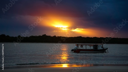 Boat in  a cloudy sunset at Superagui Island, Paraná, Brazil
