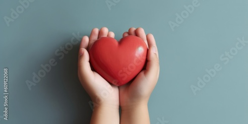 Child hands holding red heart health care  donate and family insurance concept world heart day  world health day  CSR responsibility  adoption foster family  hope  gratitude  kind  generative ai