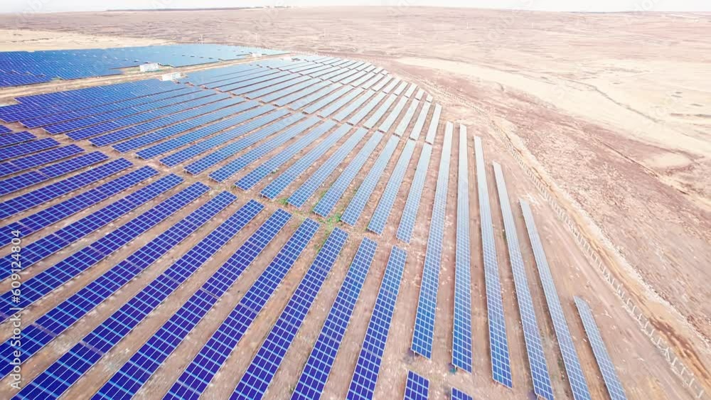 Aerial view of solar panel farm. Solar power station aerial view. Rows of solar photovoltaic panels. PV module farm in a desert. Solar energy farm high angle aerial view Aerial view of solar panel farm. Solar power station aerial view. Rows of solar photovoltaic panels. PV module farm in a desert. Solar energy farm high angle aerial view