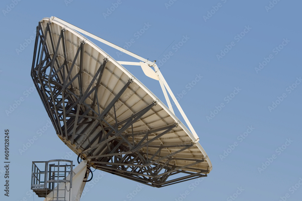 A satellite dish points skyward.