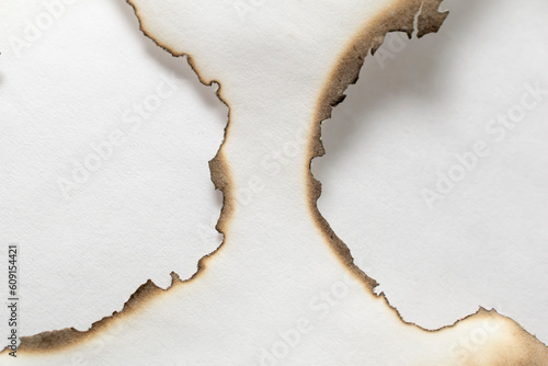 burning paper, glowing edge of paper on a white background