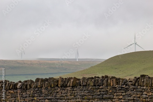 wind turbines in the fog photo