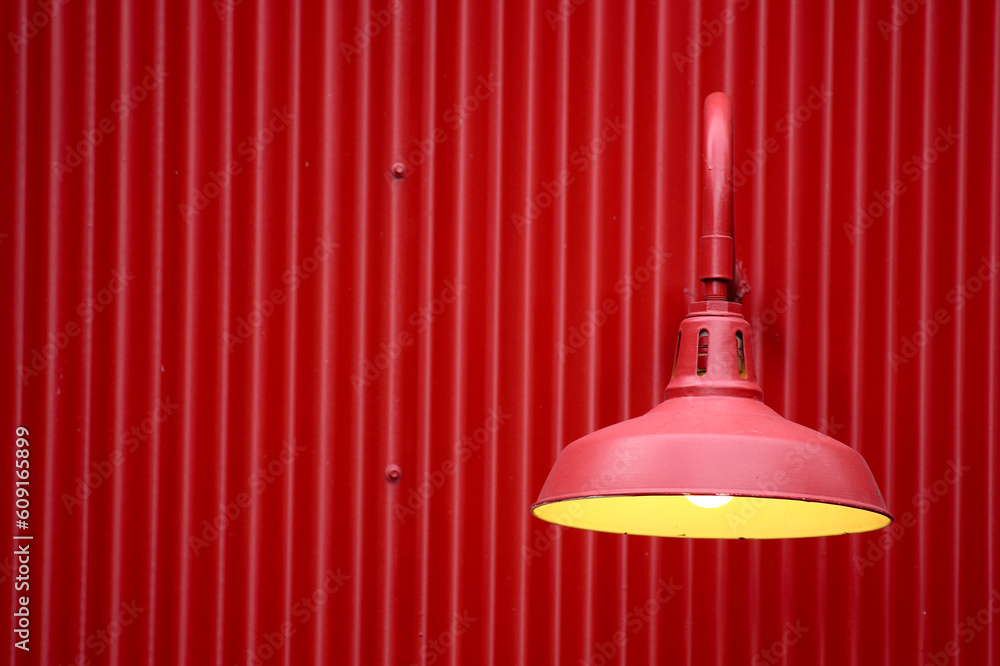 Obraz premium Red light against red metal background