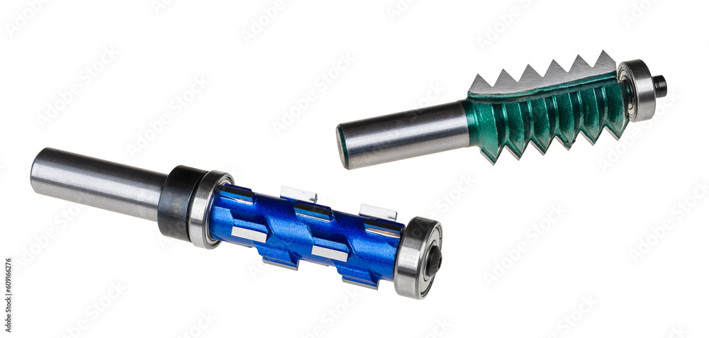 Closeup of replaceable shank router bits isolated on white background. Blue carbide spiral trimming or green shaping multi tooth milling cutter for wood working. Sharp end mills with bearing for copy. Closeup of replaceable shank router bits isolated on white background. Blue carbide spiral trimming or green shaping multi tooth milling cutter for wood working. Sharp end mills with bearing for copy.