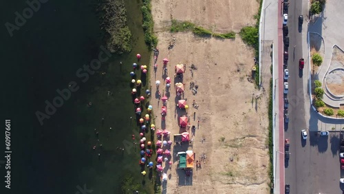 Top view of a river beach with green water photo