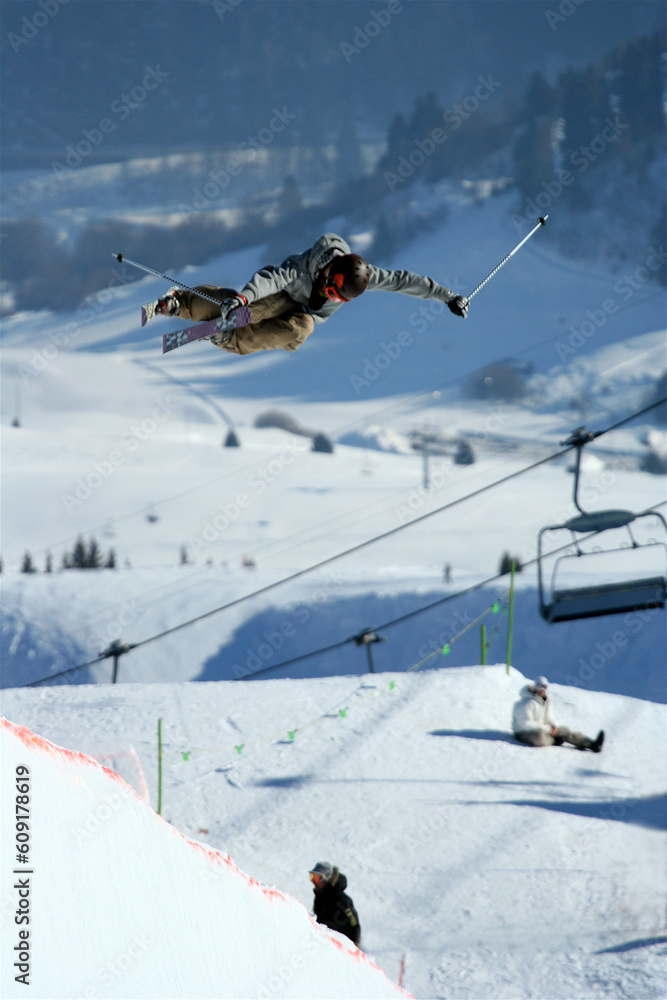 A skier riding a halfpipe.