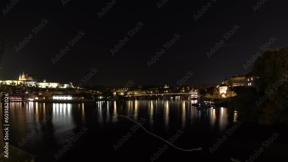 Prague night timelapse-time warp vieo of Vltava river boat trafic with views on Prague castle-Prazsky hrad,city center and national theater  