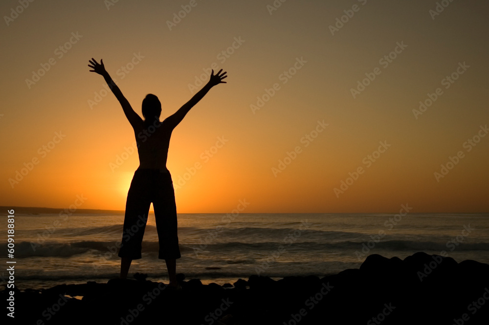 Girl expresses her freedom at La Santa beach in Lanzarote