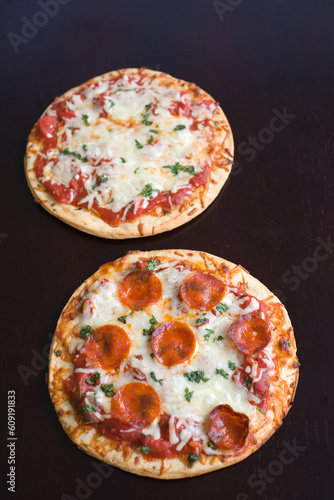 Pepperoni Pizza with mozzarella cheese and parsley fresh out of the oven