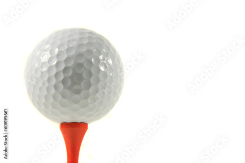 Isolation of a Golf Ball on an Orange Tee on White Background