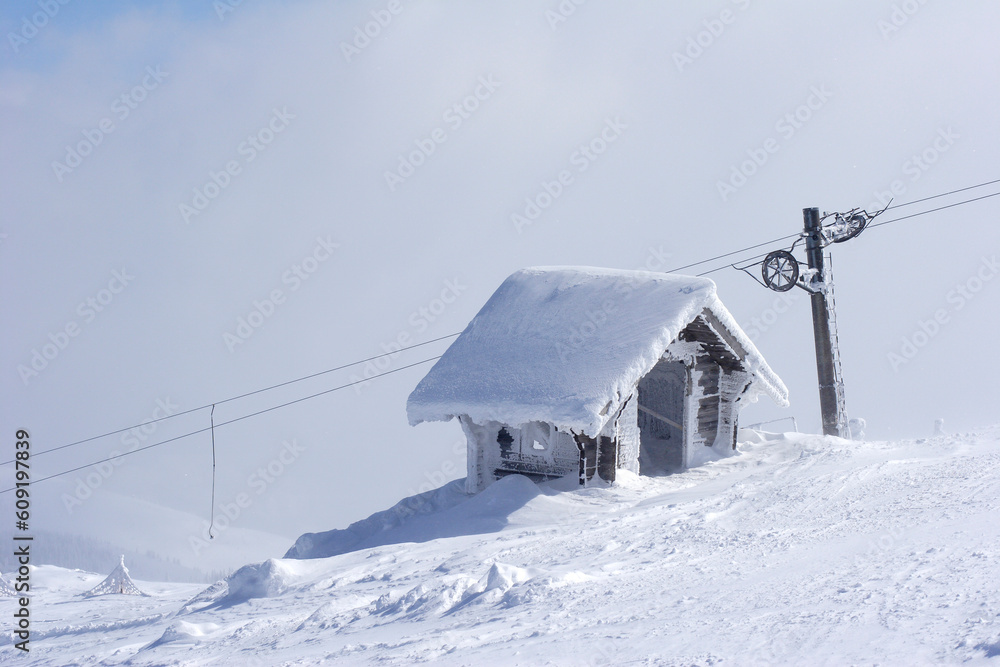 ice covered snow shelter on mountain top ice covered snow shelter on mountain top