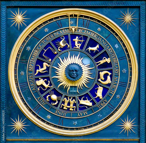 Blue zodiac clock with gold deatail and decoration photo