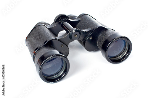 Used black binoculars with shadow on a white background. Shallow DOF