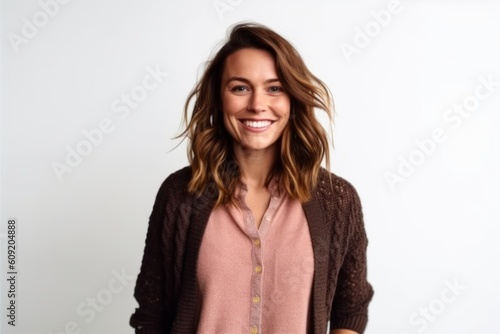 Portrait of a smiling young woman standing isolated over white background.