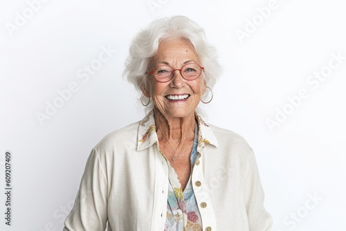 Portrait of a happy senior woman smiling at the camera on white background