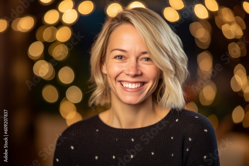 Portrait of a smiling woman with bokeh in the background