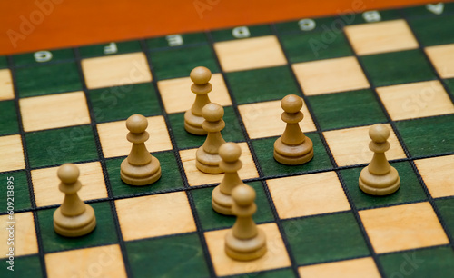 chess pieces forming an arrow focus on center