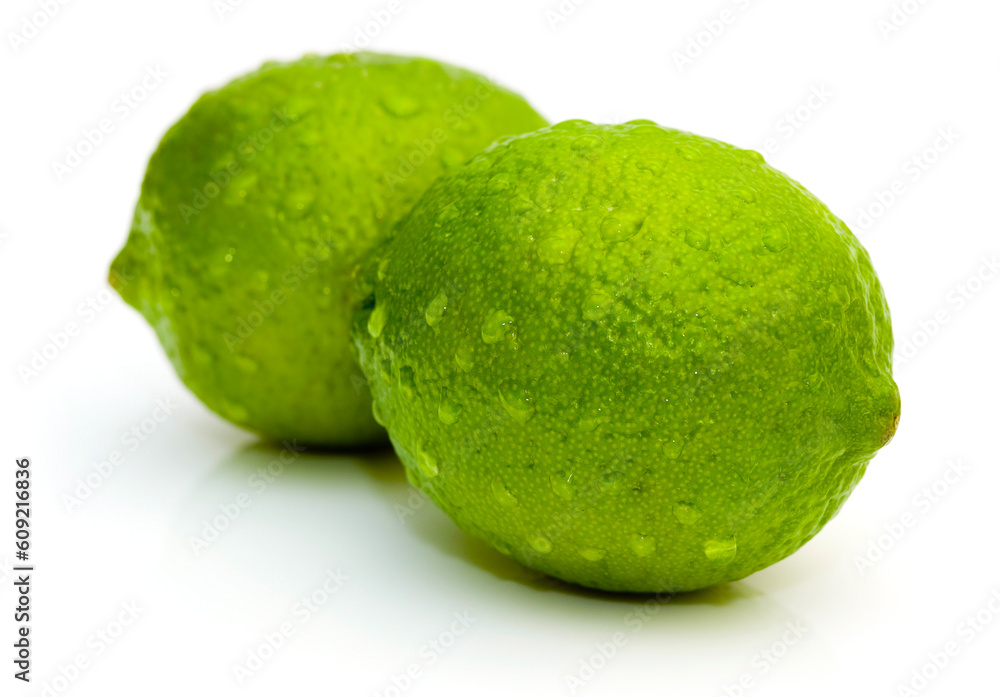 Lime with water drops isolated on white background Lime with water drops isolated on white background