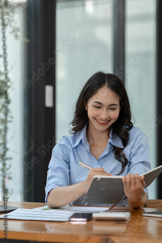 Businesswoman working using laptop to search for information Take note of the details. about financial investments Real estate business Document work to analyze the plan management system concept Free Download Businesswoman working using laptop to search for information Take note of the details. about financial investments Real estate business Document work to analyze the plan management system concept - GFXLoad