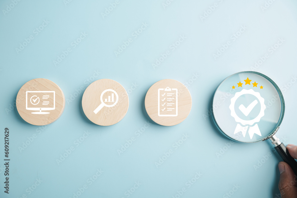 Magnifying glass showcases an aligned icon symbolizing quality