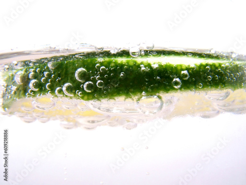 Slice of lime in glass of soda water