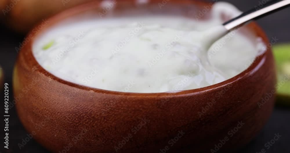 milk fresh yogurt with kiwi flavor and kiwi slices, fresh yogurt made from natural ingredients with kiwi milk fresh yogurt with kiwi flavor and kiwi slices, fresh yogurt made from natural ingredients with kiwi