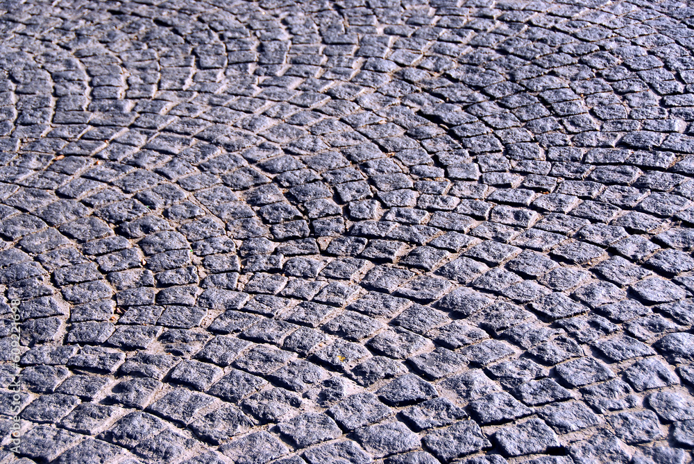 Background of old cobble stone granite pavement Background of old cobble stone granite pavement