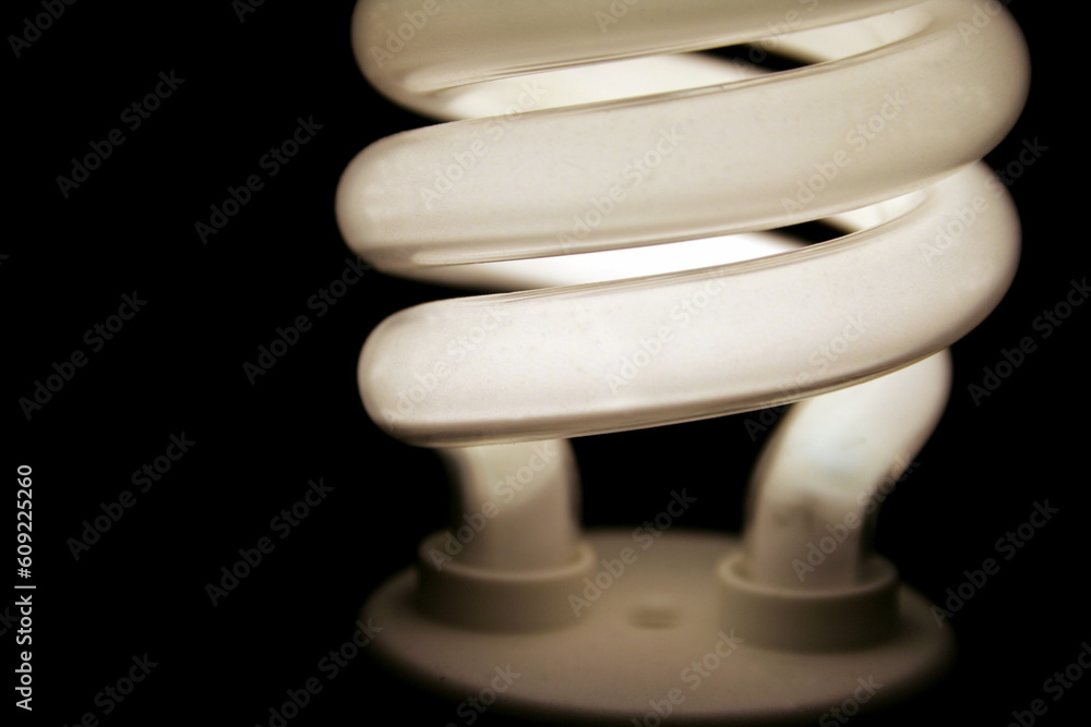 A closeup of an energy saver compact flourescent light bulb. A closeup of an energy saver compact flourescent light bulb.