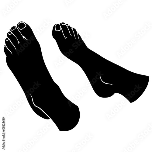 Barefoot feet of a lying woman. Black and white negative silhouette.