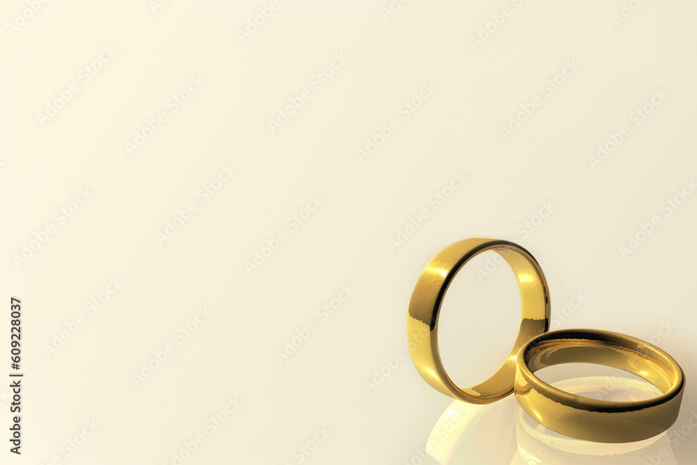 two gold rings on cream background two gold rings on cream background