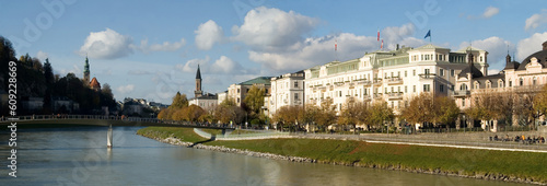 Elegant buildings line the Salzach River  downtown Salzburg  Austria.