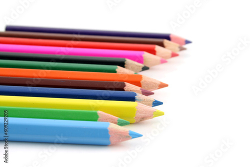 Colored pencils on a white background with a shallow DOF