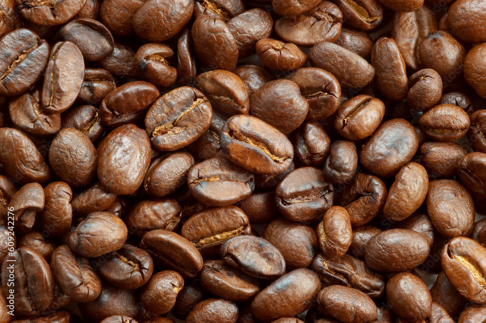 textured background: brown roasted coffee beans macro closeup textured background: brown roasted coffee beans macro closeup