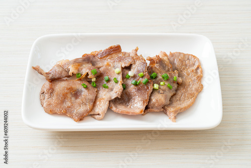 grilled pork neck sliced on plate