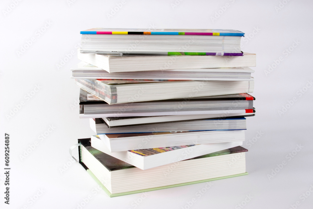 A stack of books against a plain background A stack of books against a plain background