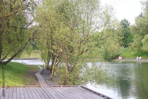 Photography Landscape with a river, trees and blue sky in the urban landscape park Yuzhnoye Butovo, Moscow, June 2023