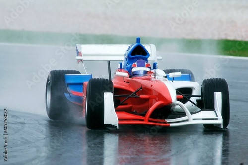 A race car on wet track.