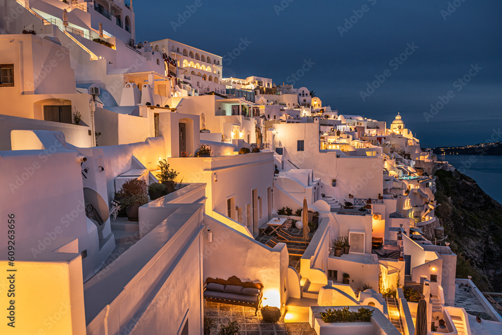 Night lights after sunset at Santorini island, Greece. White architecture in Fira town.