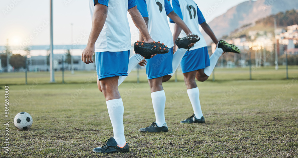 Fototapeta premium Soccer, team sports and stretching legs on field for fitness, exercise and training outdoor. Football ball, pitch and club for athlete men together for sport competition, wellness and muscle warm up