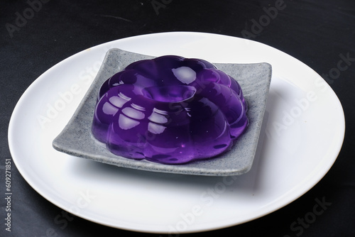 a beautiful and luxurious purple jelly or jelly placed on a white plate