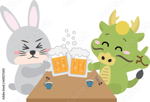 忘年会、新年会などの宴会でビールで乾杯する龍とうさぎ