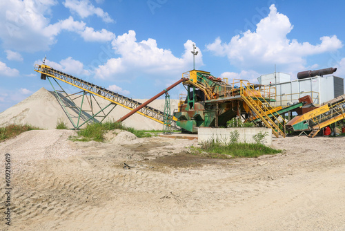 Sand quarry panorama landscape mound machinery working machinery extract extraction
