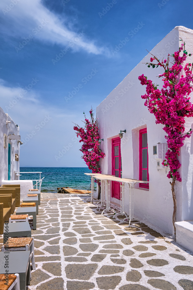 Beautiful alleyway of Greek island towns open to seafront on sunny day