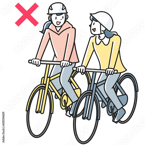自転車で並走する若い女性たち