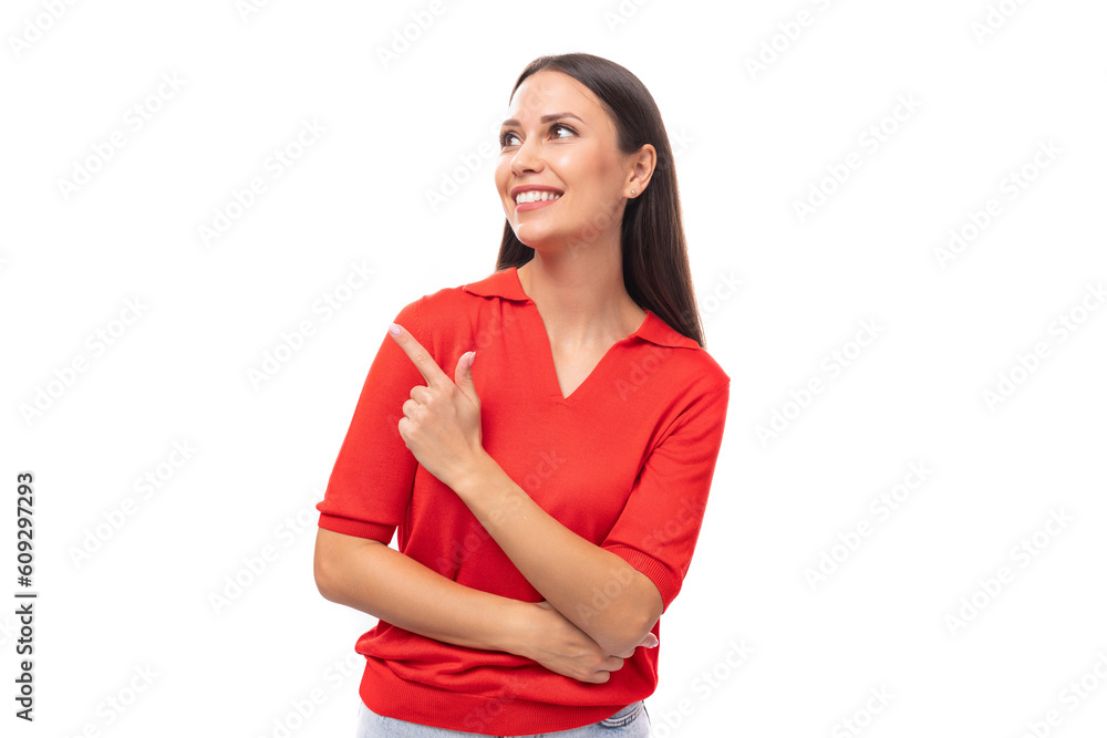 portrait of a cute young european brunette lady in a red t-shirt actively gesturing with her index finger towards the wall portrait of a cute young european brunette lady in a red t-shirt actively gesturing with her index finger towards the wall