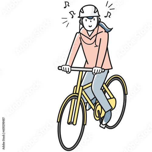 イヤホンで音楽を聴きながら自転車で走る若い女性