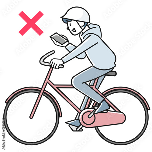 スマホを見ながら自転車で走る若い男性