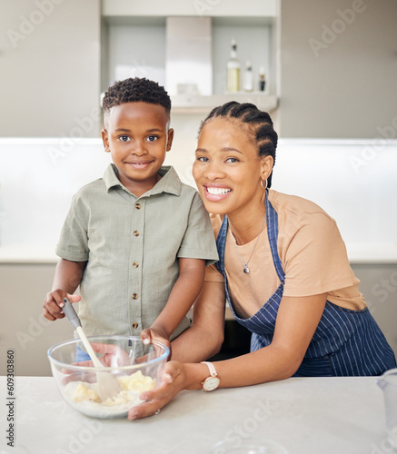 Mother, son and happy baking portrait at kitchen counter with help and love. Black woman or mom and child together in family home to learn about cooking food, dessert and pancakes for development